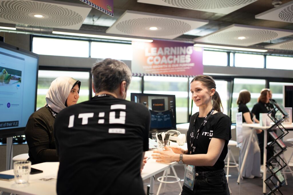 Female Learning Coach talking to people